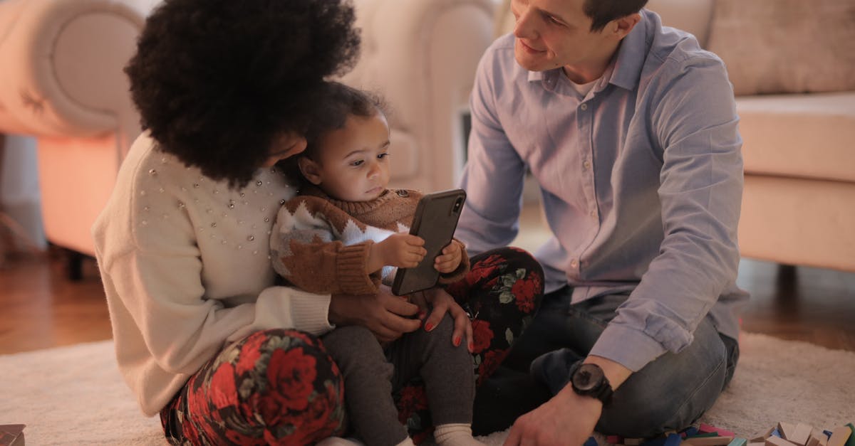 Using no-show ticket for infant - Man and Woman Having Fun With Their Child