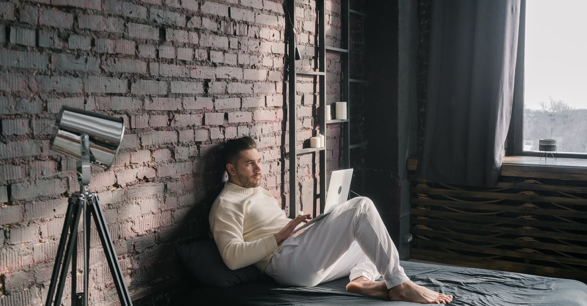 Using tickets from Vienna to Budapest - Man in White Dress Shirt Lying on Bed