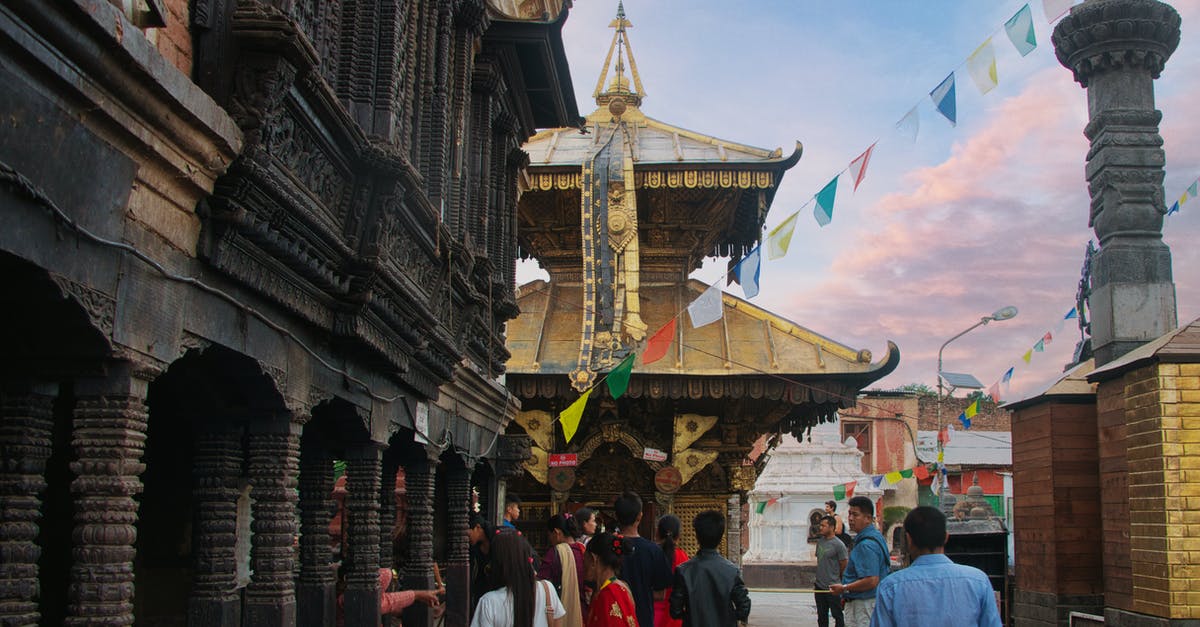 Vaccination for Nepal - People Walking on Street Near Brown Concrete Building