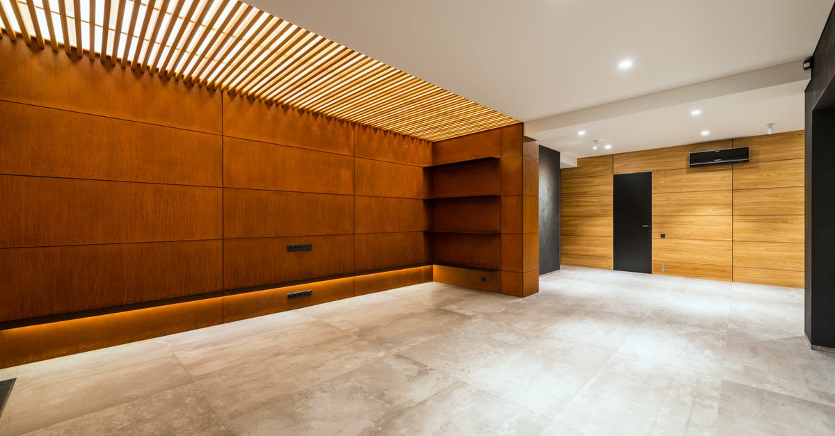 Vaccine certificate conditions for Armenia entrance - Modern corridor interior with entrance door and air conditioning against wooden shelves above floor in house