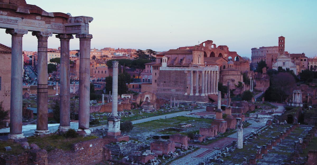 Validity of UK passport required to visit Italy - Ruins of ancient city under blue sky at sunset