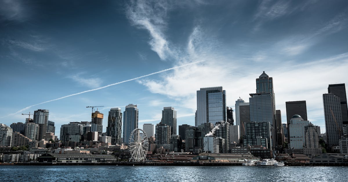 Vancouver to Seattle by Ferry - Photo of White Ferris Wheel Across City Buildings