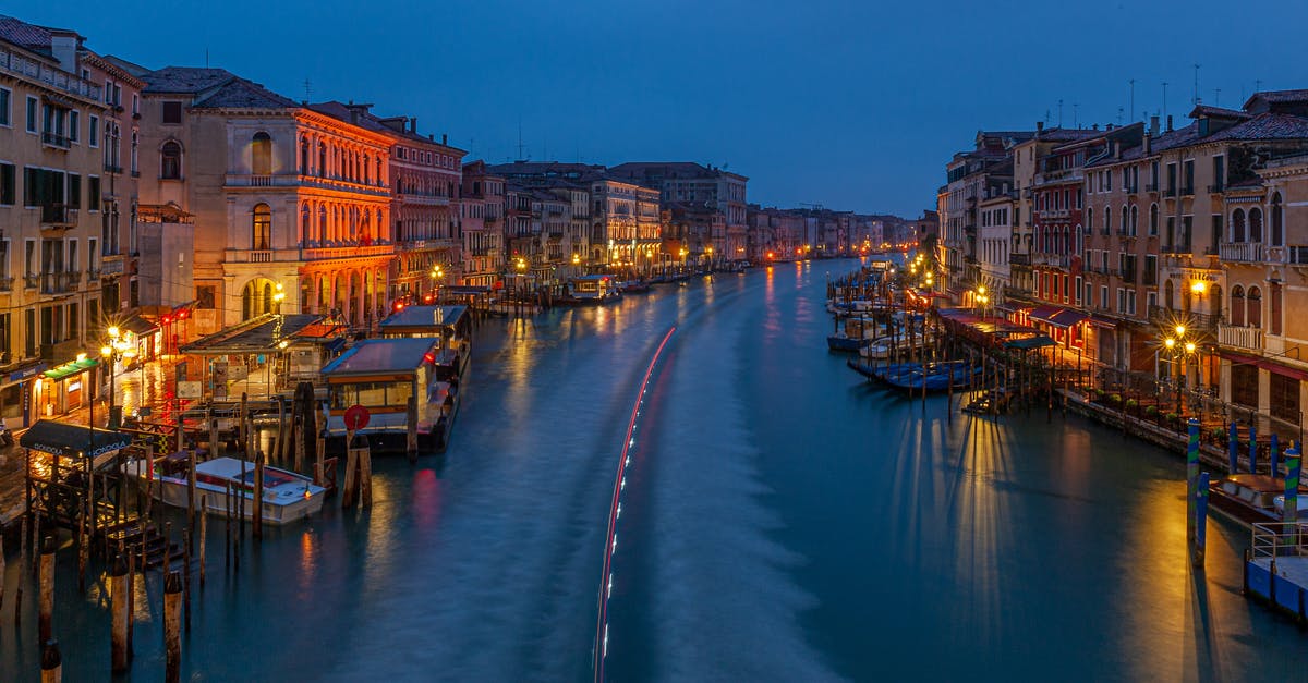 Venice in late October / early November [duplicate] - Brown Boat on River Near City Buildings during Night Time