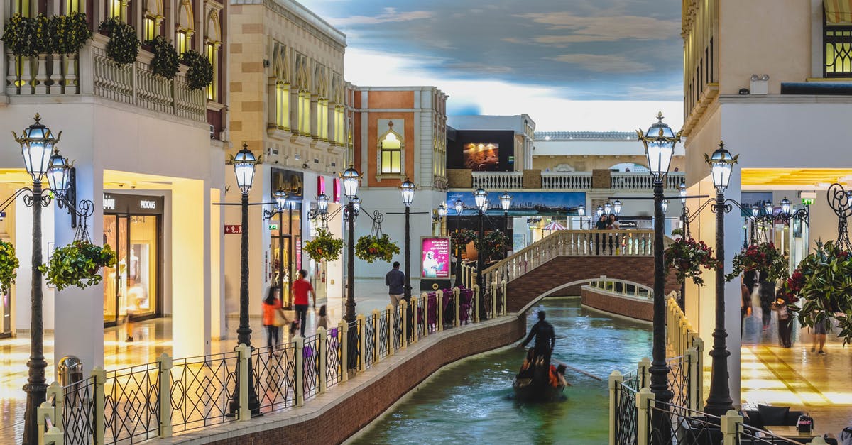 Venice tourist volume - Concrete Buildings With River and Bridge