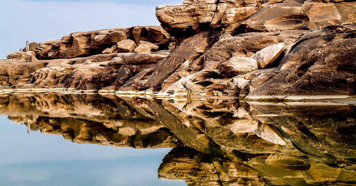 View the Grand Canyon by helicopter - is it real? - Rock Formation Mirrored by Water