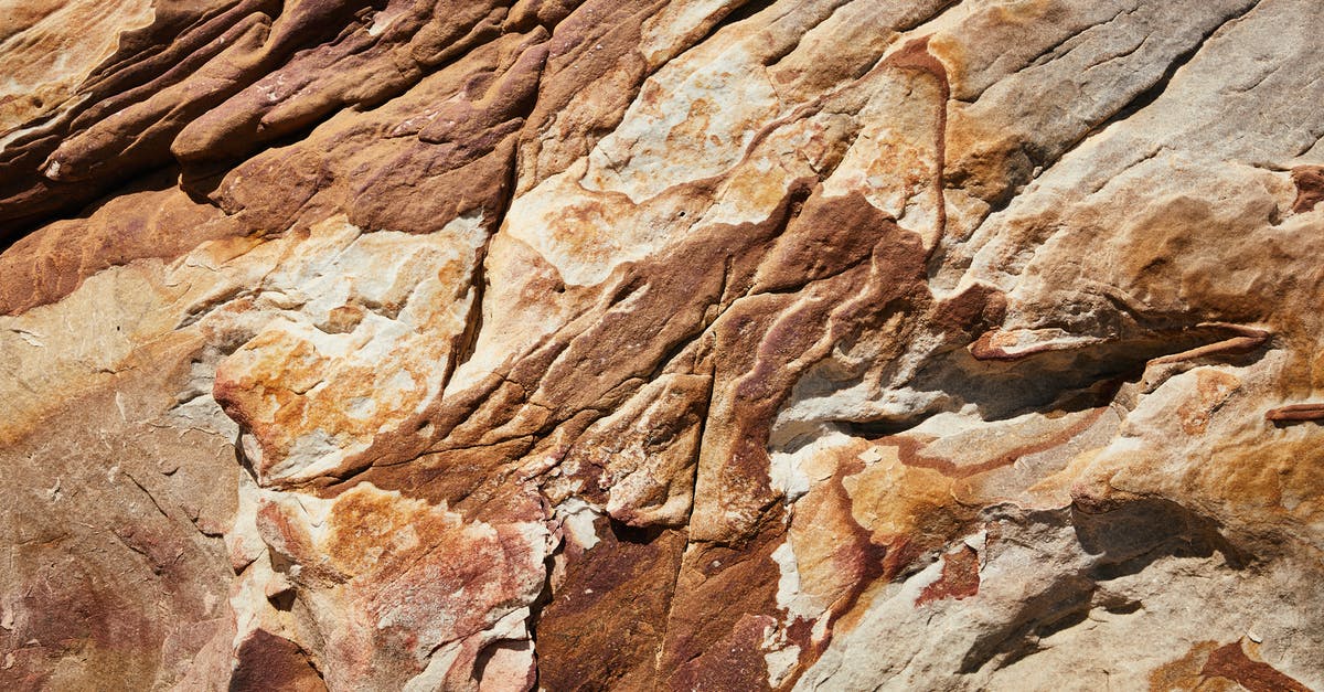 Viewing, not hiking, Mount Kilimanjaro from Arusha - Top view of rough rocky formation surface with uneven bristly texture and relief