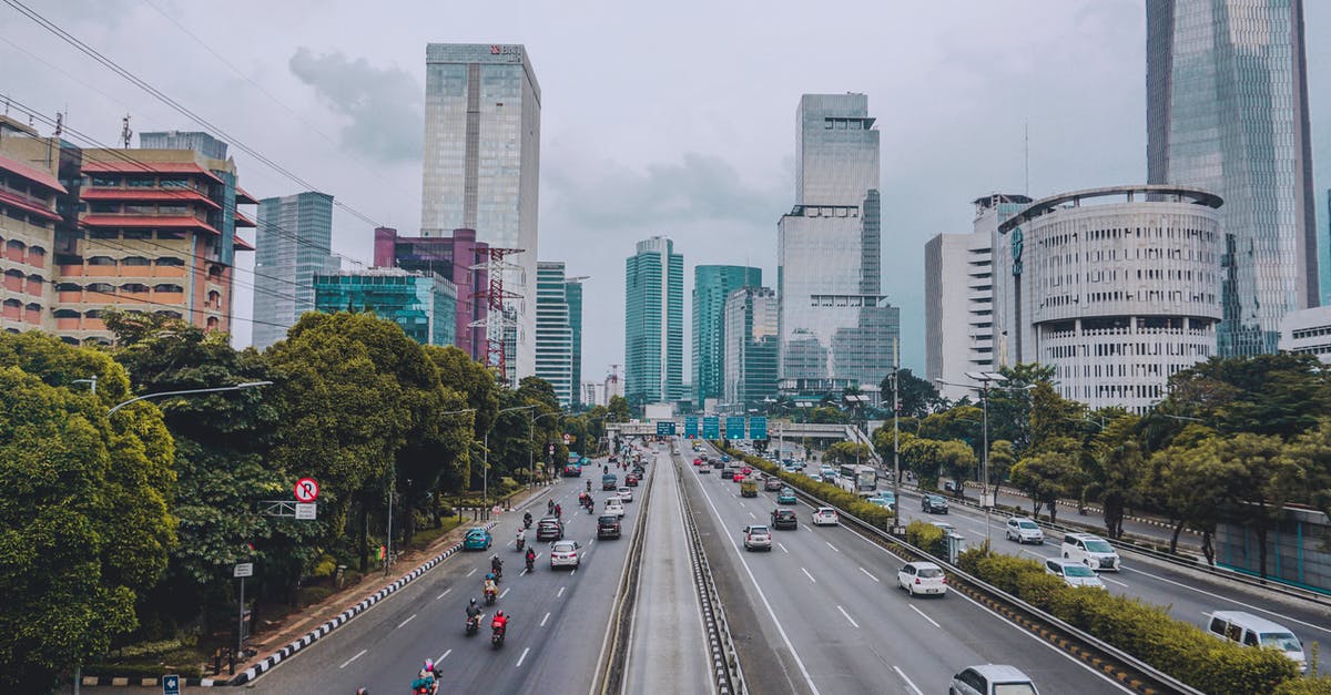 Visa expired while in Jakarta - Wide Angle Photography of Vehicles Traveling on Road