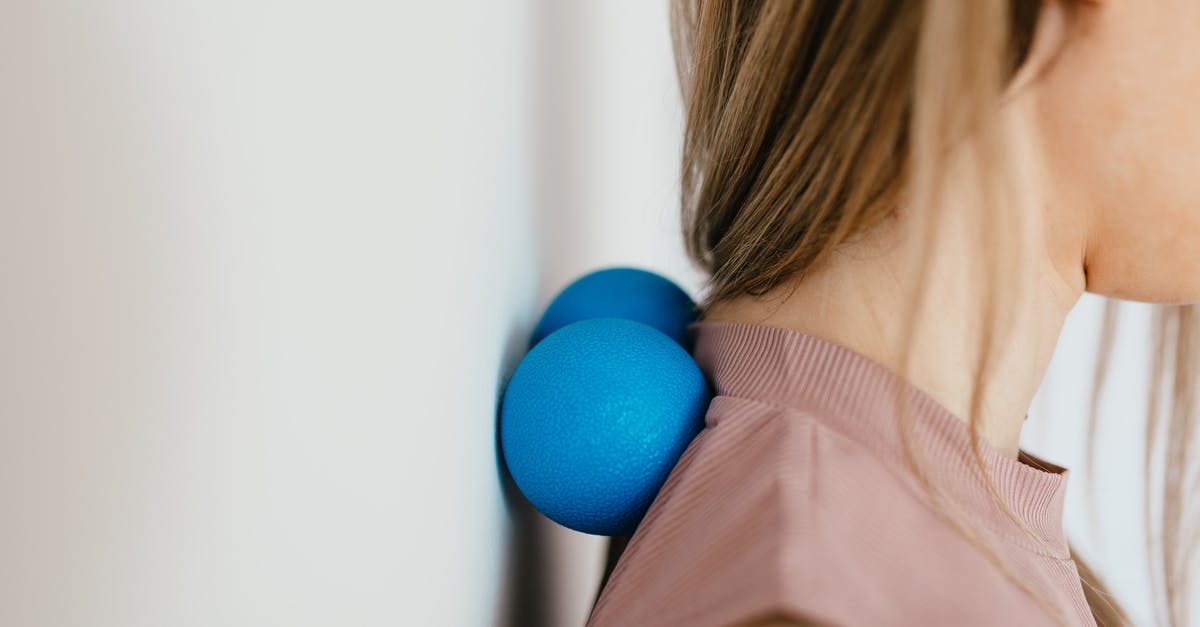 Visa extension after injury - Close-Up Photo of a Woman Pressing Her Neck on a Stress Ball