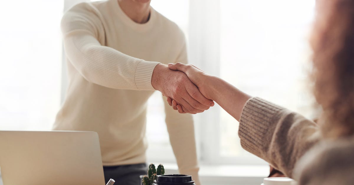 Visa for Belgium visit as well as business meeting [closed] - Man and Woman Near Table