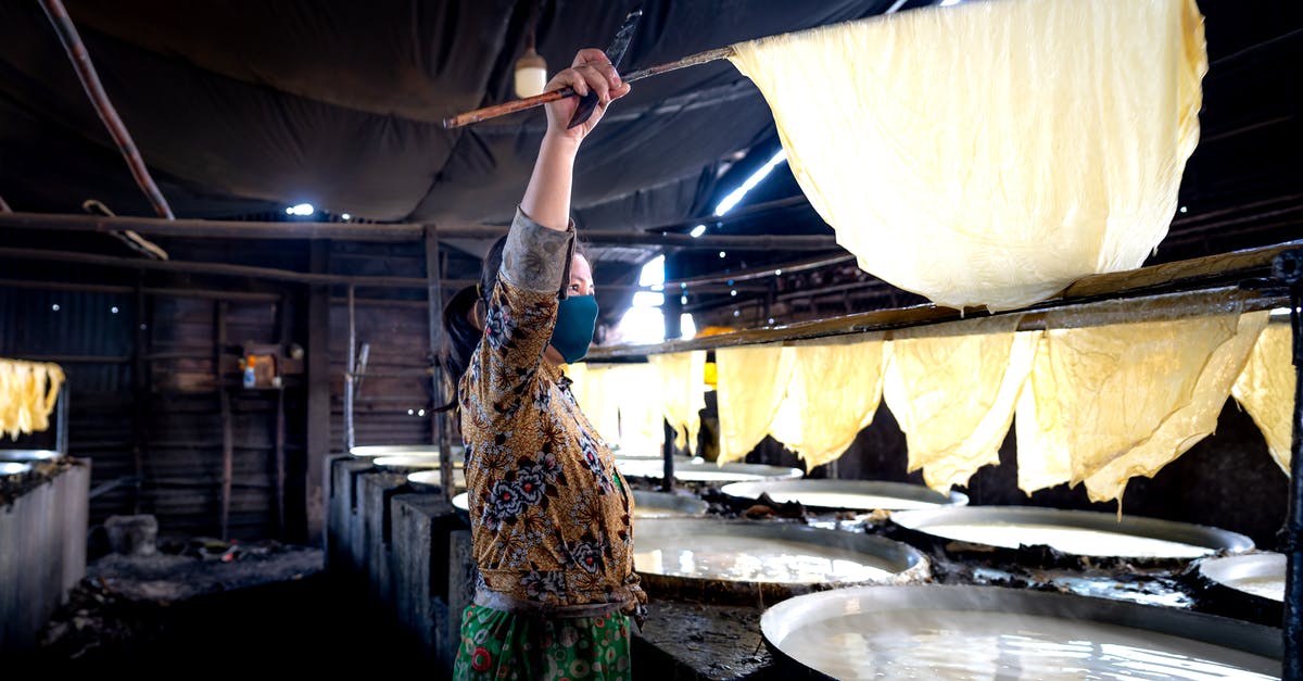 Visa for checking in luggage in Vietnam - A Woman Checking the Rice Paper