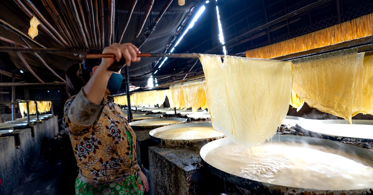 Visa for checking in luggage in Vietnam - A Woman Checking the Rice Paper