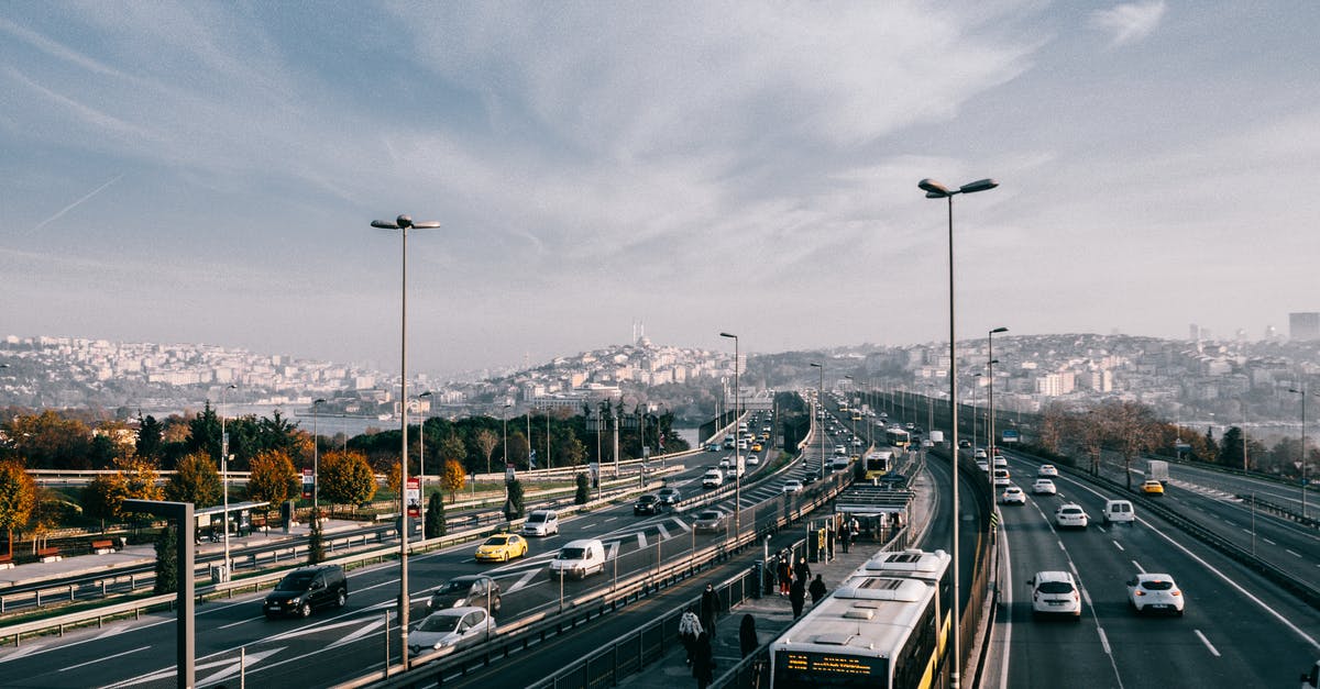 Visa for Istanbul trip during layover - Multiple lane highway with driving vehicles located in Istanbul city suburb area on autumn day