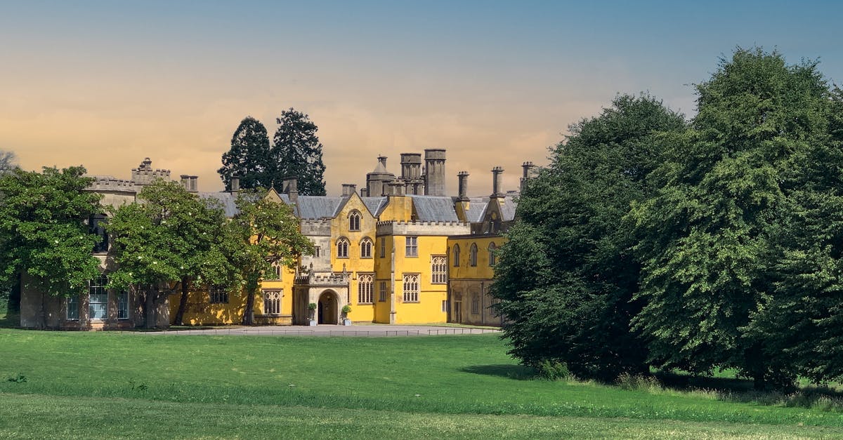 Visa for volunteering in England - Brown Concrete Building Near Green Trees