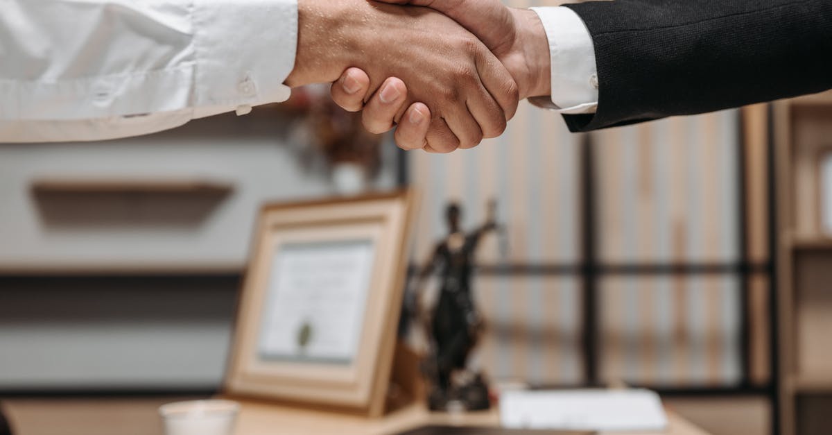 Visa thru a lawyer [closed] - Close Up Photo of People Shaking Hands