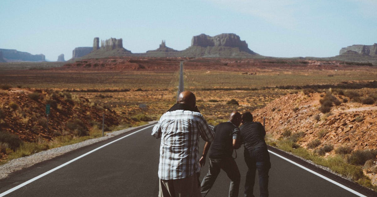 Visa-free Travel Route on a Pakistani Passport - Unrecognizable black men on asphalt road