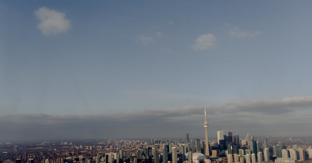 Visitation and Permanent residence in Canada [closed] - High skyscrapers of modern office district located on shore of river in Canada