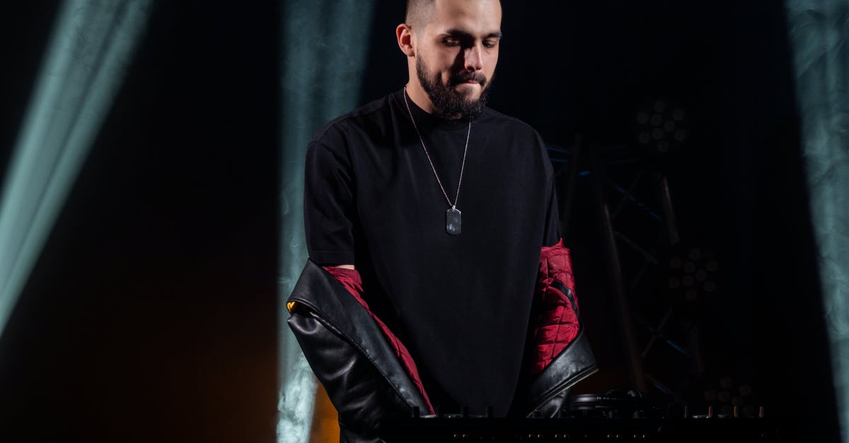 Visiting a concert in japan - Man in Black and Red Zip Up Jacket