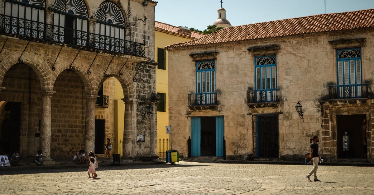 Visiting Cuba twice in short period, exceeding 30 days - People Walking Near Brown Concrete Building