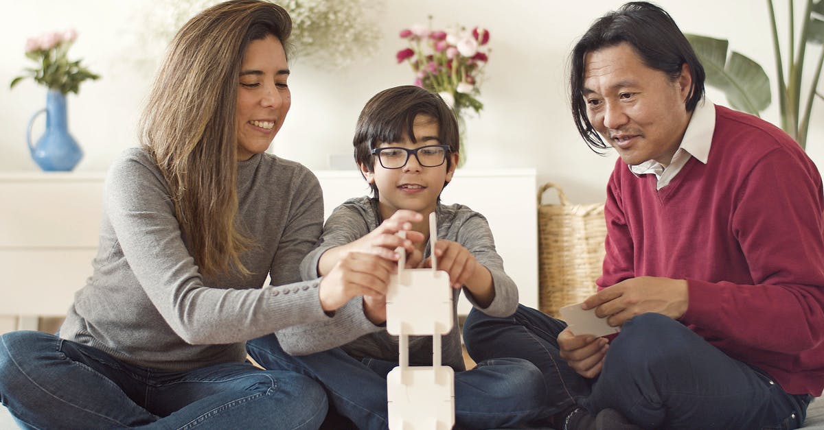 Visiting Japan as an Indian citizen - visa requirements? - A Family Building a Tower with White Square Boards