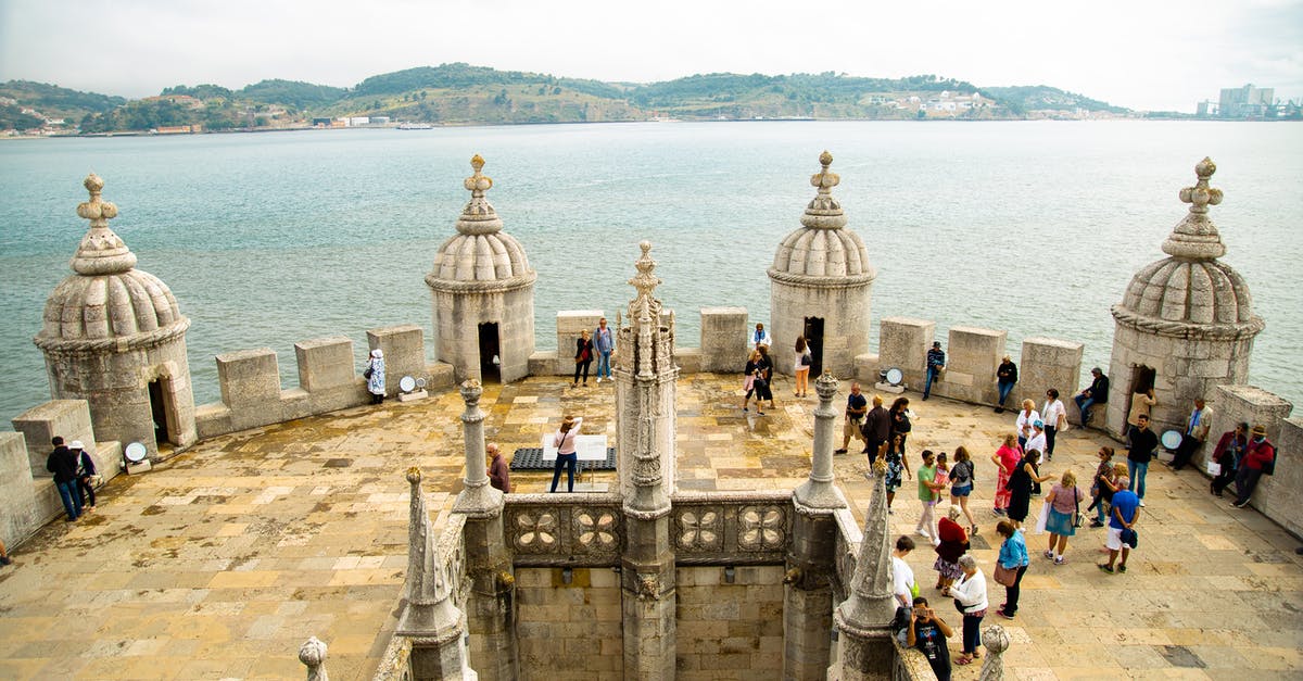 Visiting Paris while in Transit to Portugal - Tourists walking on Belem Tower top