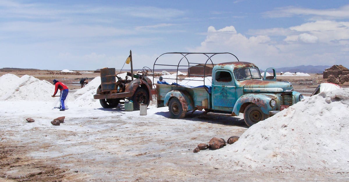 Visiting salt flats in Bolivia from Chile - Blue Truck Quarrying Salt in Bolivia