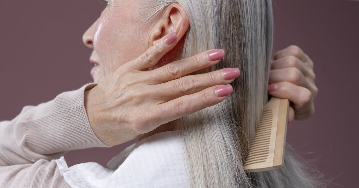 Visitor visa for Grandmother - Woman in White Long Sleeve Shirt Covering Her Face