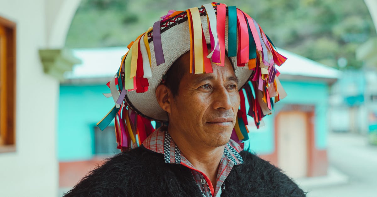 Visitor visa to re-enter USA after 1 month in Mexico - Portrait Photo Of Man Wearing Traditional Headwear