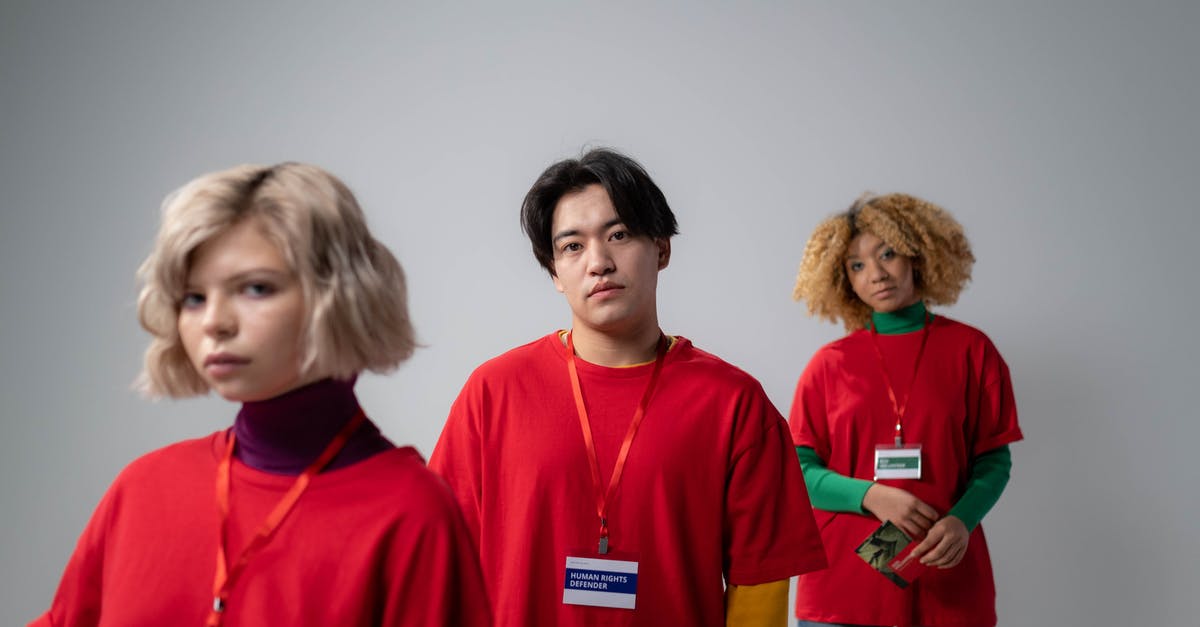 Volunteering work - Three People in Red Crew Neck Shirt Uniform