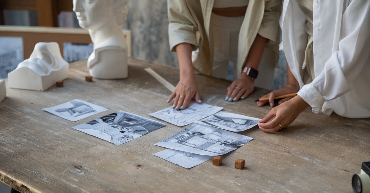 Voluntourism - how to evaluate - Pencil Drawings on Wooden Table and Women Hands