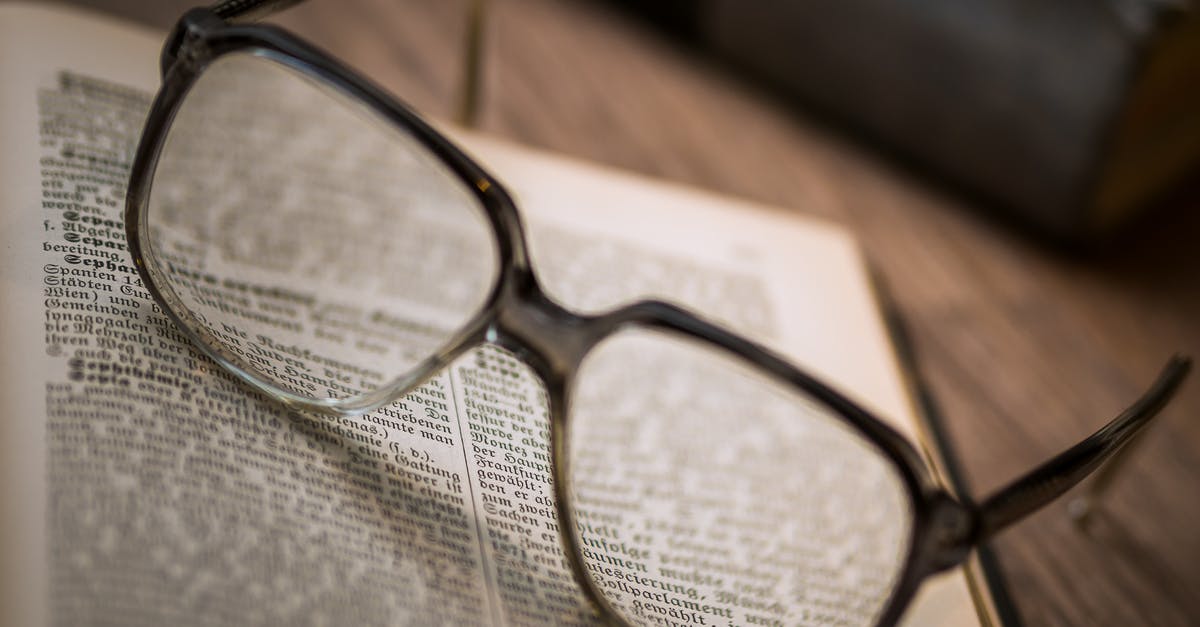 Warning paper stapled to back cover of passport [closed] - Close-up of Eyeglasses