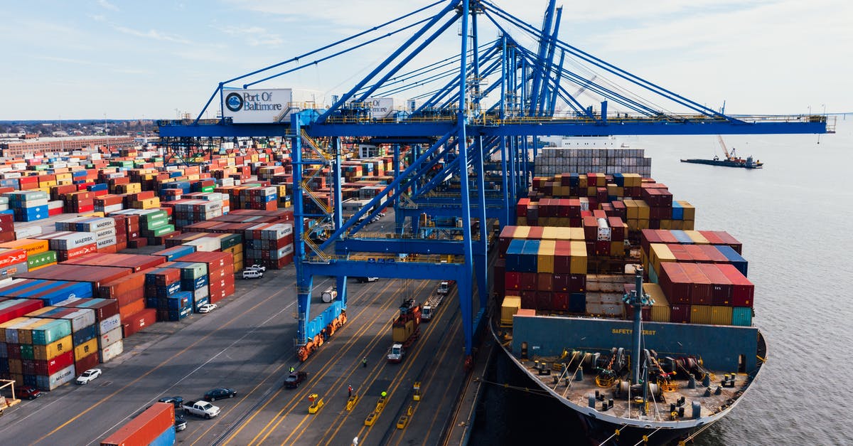 Watching container ships in SF bay area? - Cargo ship unloading colorful containers in port