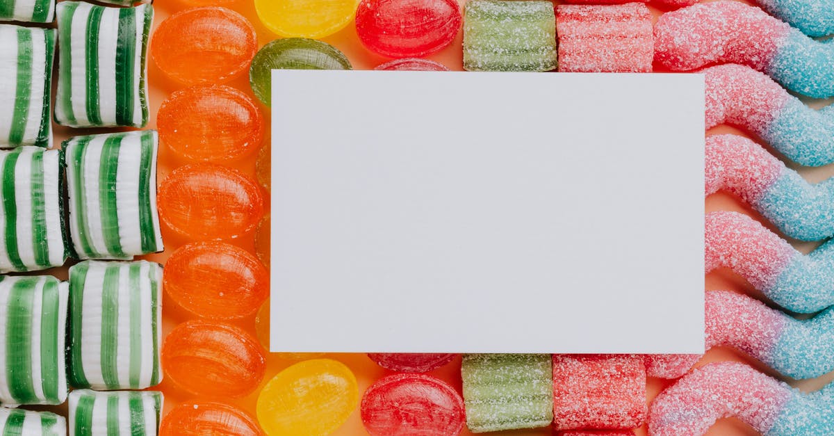 What's a good prepaid SIM card for data in Ireland? [closed] - Top view closeup of blank paper card placed on multicolored various shapes yummy candies in light confectionery