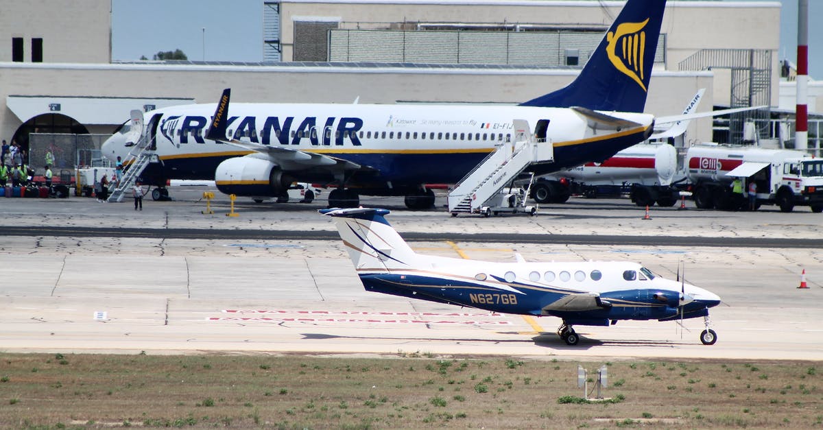 What's the best way to get from Madrid Airport to Sevilla? - Civil utility and narrow body aircraft parked on runway tracks near modern airport building against cloudless blue sky What's the best way to get from Madrid Airport to Sevilla? - Civil utility and narrow body aircraft parked on runway tracks near modern airport building against cloudless blue sky