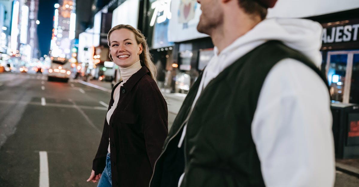 What's the cheapest stable route to cross the Pacific? - Positive couple walking on road