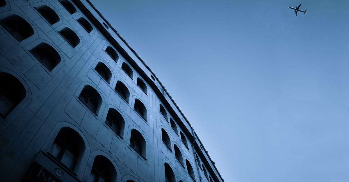 What's the difference between SkyTeam and Flying Blue? - Low Angle Photo of Concrete Building Under Blue Sky