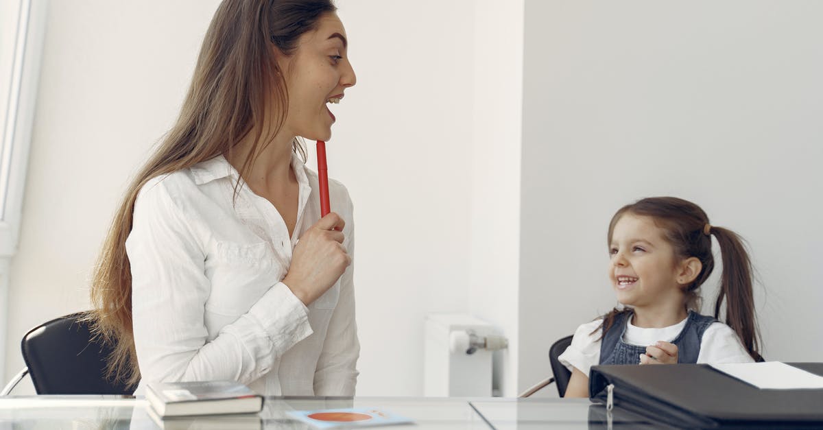 What's the difference in content and focus between "Wallpaper*" guidebooks and others? - Cheerful woman and kid having fun in office