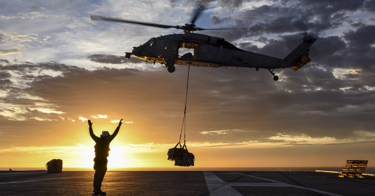 What's the longest scheduled helicopter flight? - Silhouette Man Standing on Road Against Sky during Sunset