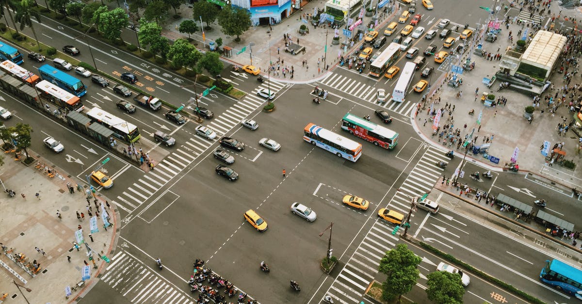 What's the name of this traffic-control structure found at some checkpoints? - Aerial Photography of Cars on Road Intersection