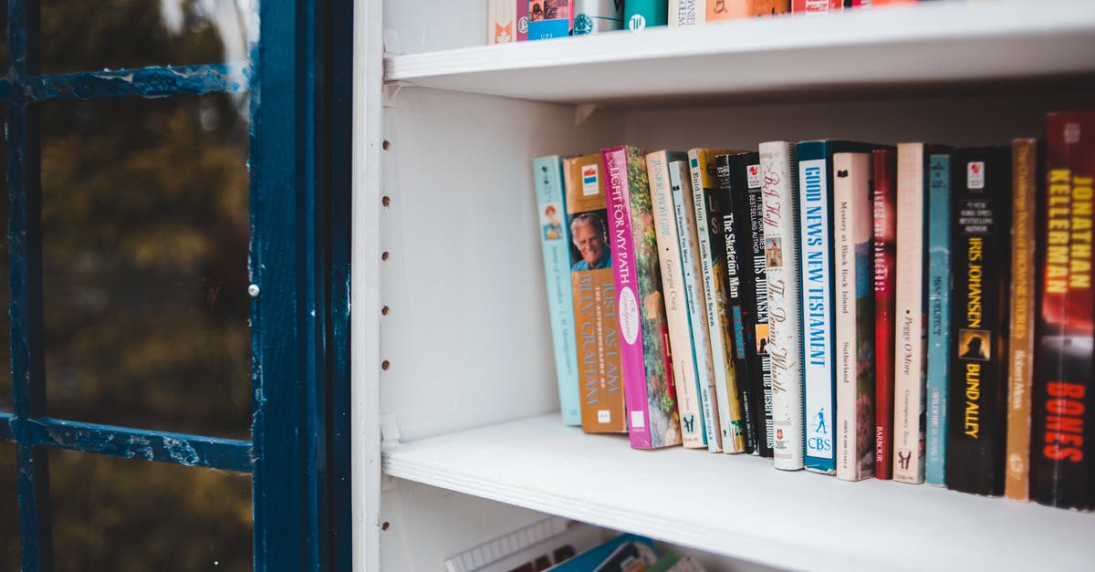 What's the preferable option to book a flight? - Various books placed on white shelf