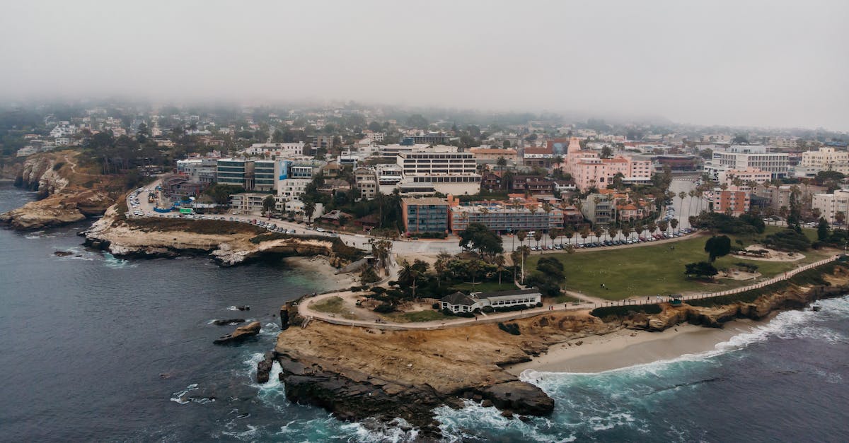 What affordable beachfront hotels in or near San Diego should I consider? - Aerial Photography of Buildings Beside of Sea