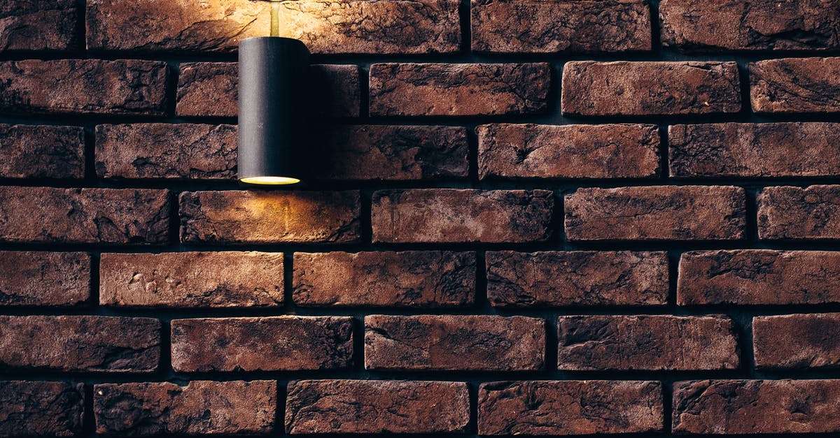 What and where is this old-looking stone building? - Tubular Black Sconce