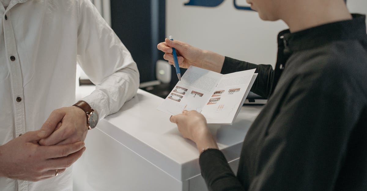 What are frequent flyer awards? - A Woman Explaining the Contents of the Brochure