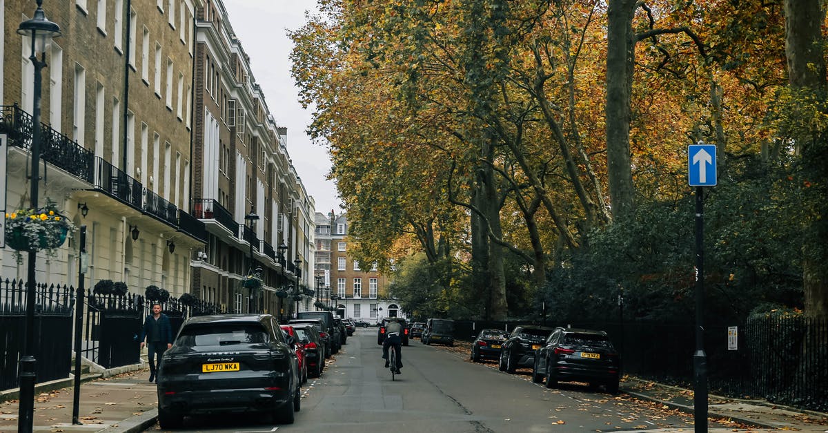 What are my cellular options in London - Cars Parked on Sidewalk Near Building