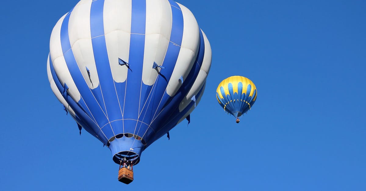 What are possible reasons for this strange flight pattern? - Two Blue and Yellow Hot Air Balloon