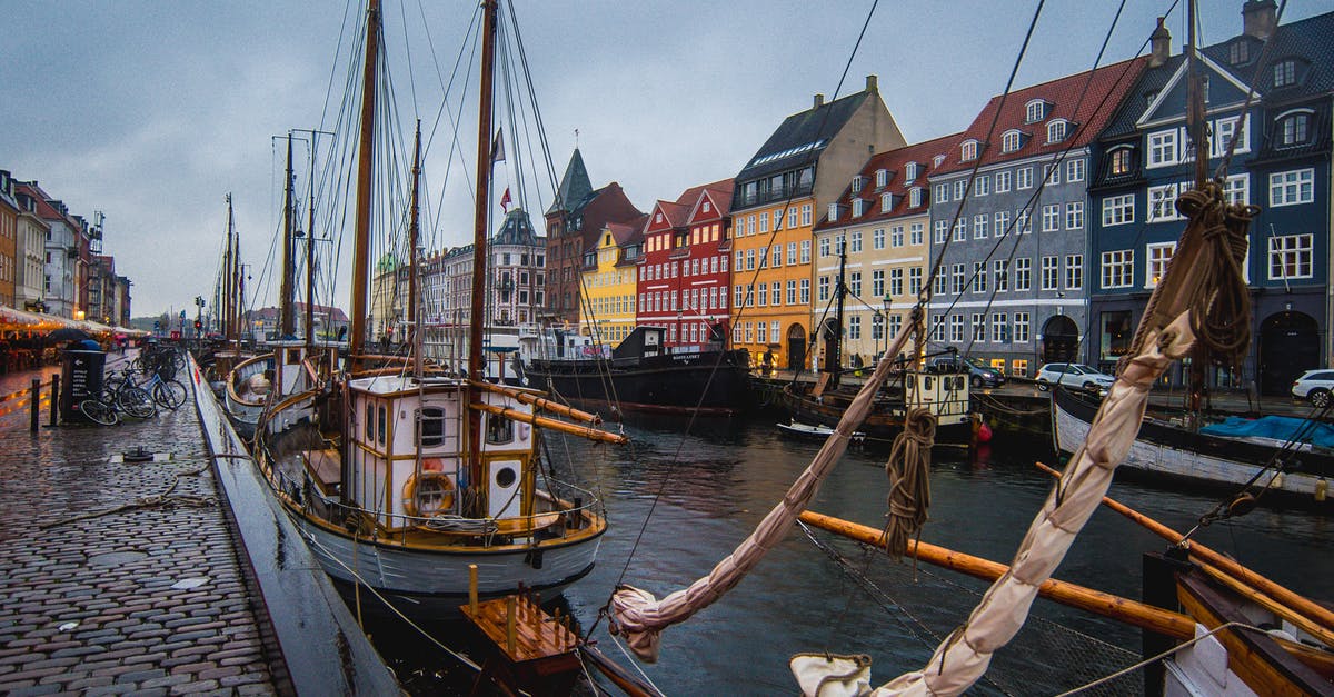 What are the candles outside in Denmark about? - Photo Of Boats During Daytime