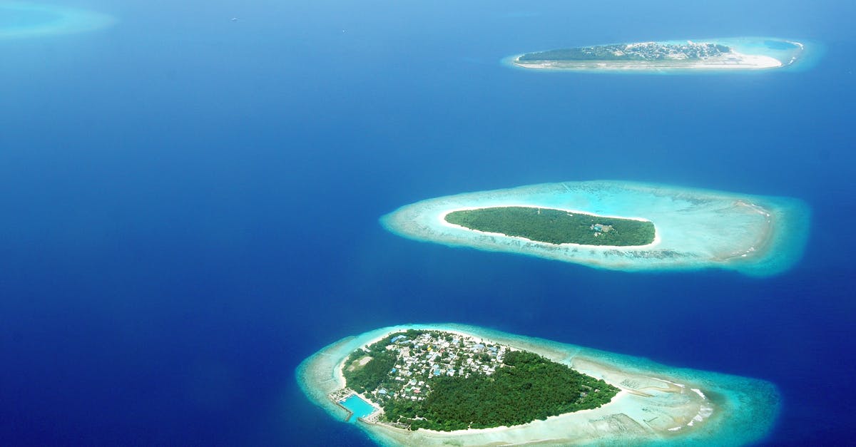 What are the current regulations to move between islands in Maldives? - Bird's Eye View Photography Of Islands