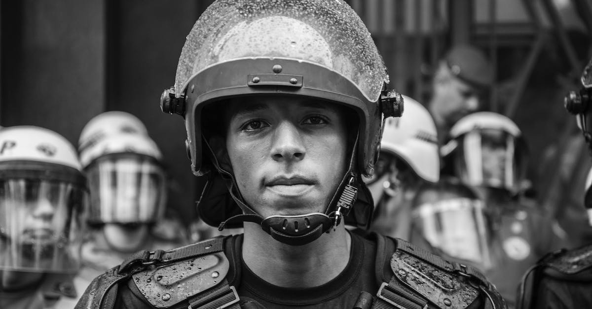 What are the fake police checkpoints in Mexico looking for? - Grayscale Portrait Photo of Man Wearing Helmet