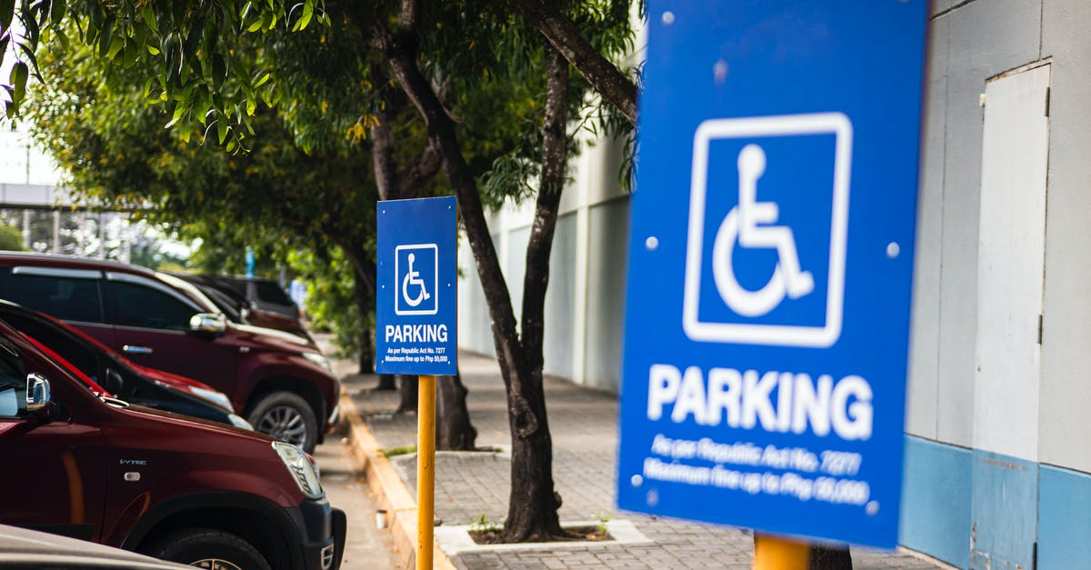 What are the parking regulations in Brooklyn? - Disabled parking sign on street with transport