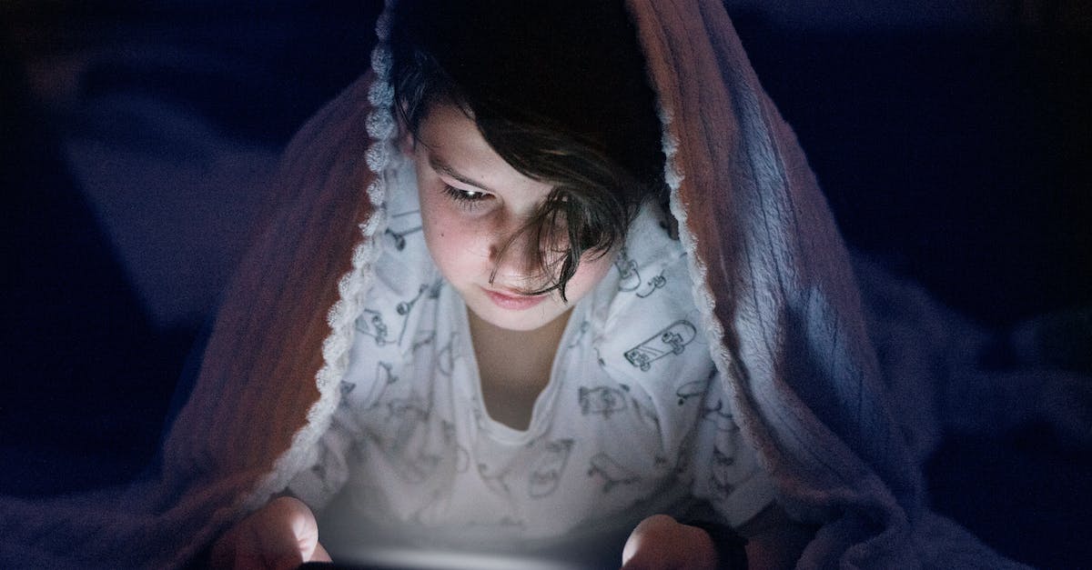 What are the signs of a bed bug infestation? - Woman in White Shirt Reading Book