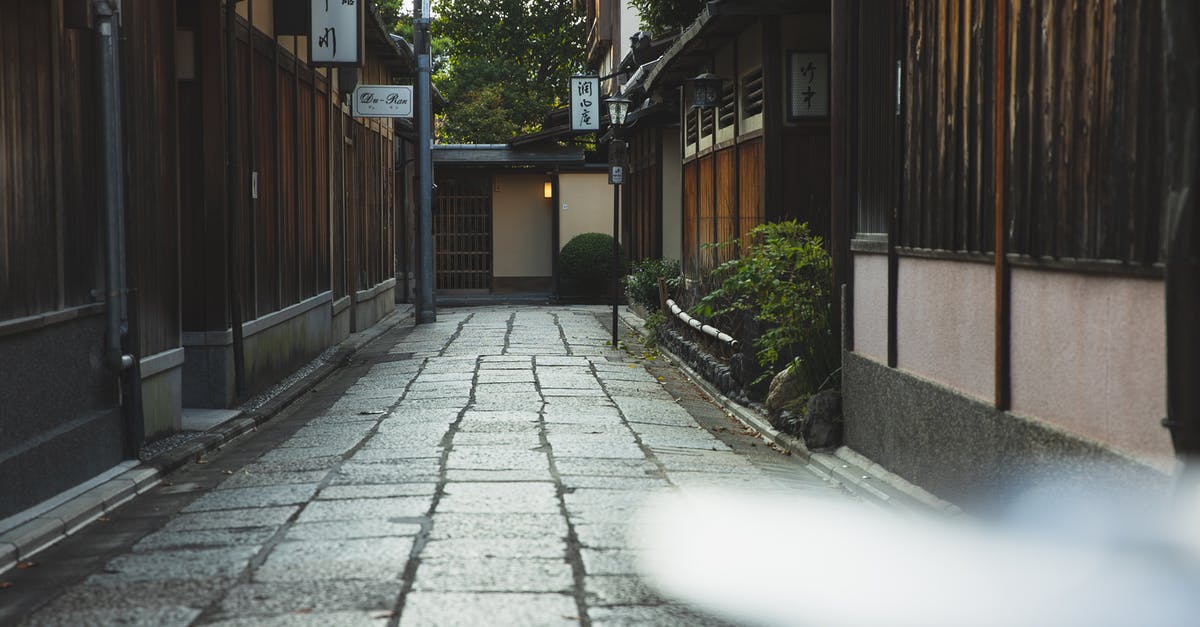 What are the typical meals in Japan? - Empty paved street in historic town in Japan